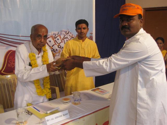 Felicitation of Dr. M. Chidananda Murthy by HJS member